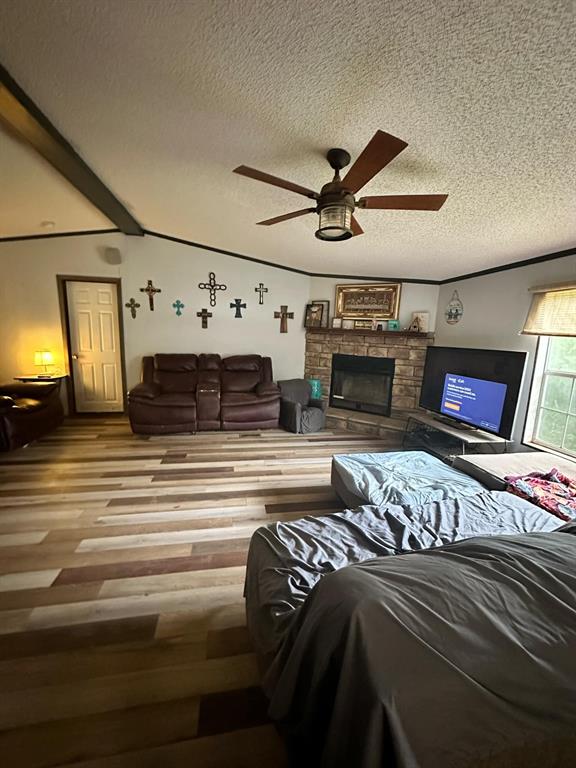 9937 County Road 3250 Timpson, TX 75975 - Photo 22 of 40 a view of a livingroom with furniture and a fireplace