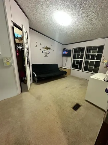 a bed room with a bed and a window