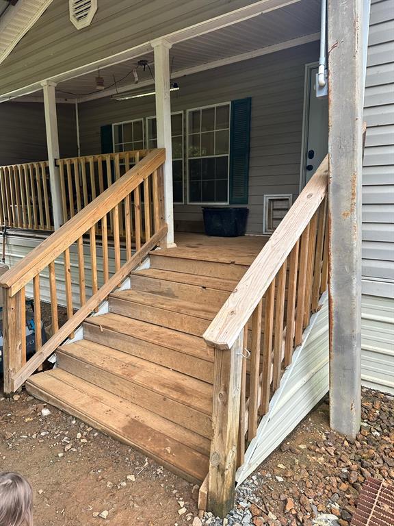 9937 County Road 3250 Timpson, TX 75975 - Photo 25 of 40 a view of stairs with wooden floor and windows