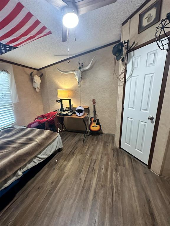 9937 County Road 3250 Timpson, TX 75975 - Photo 26 of 40 a bed room with a bed and a window