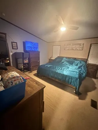 a kitchen with sink cabinets and wooden floor