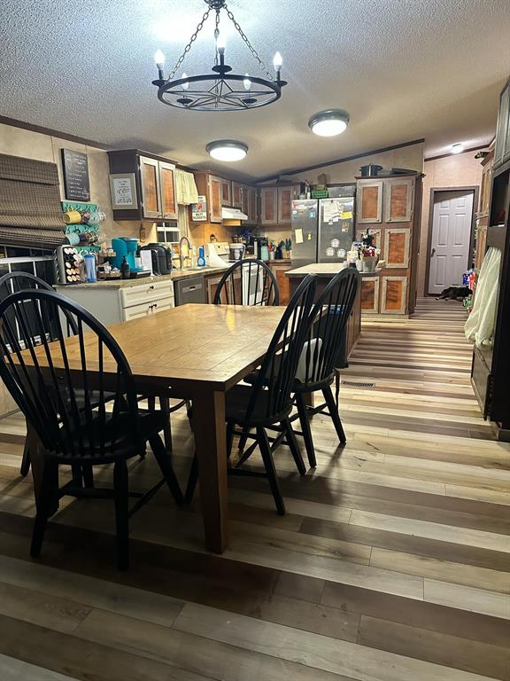 9937 County Road 3250 Timpson, TX 75975 - Photo 31 of 40 a view of a dining room with furniture window and wooden floor