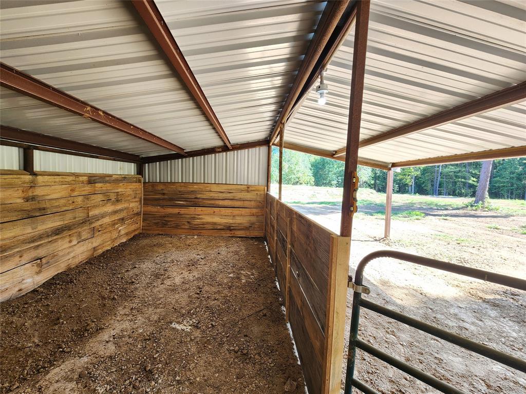 9937 County Road 3250 Timpson, TX 75975 - Photo 9 of 40 a view of a room with wooden floor