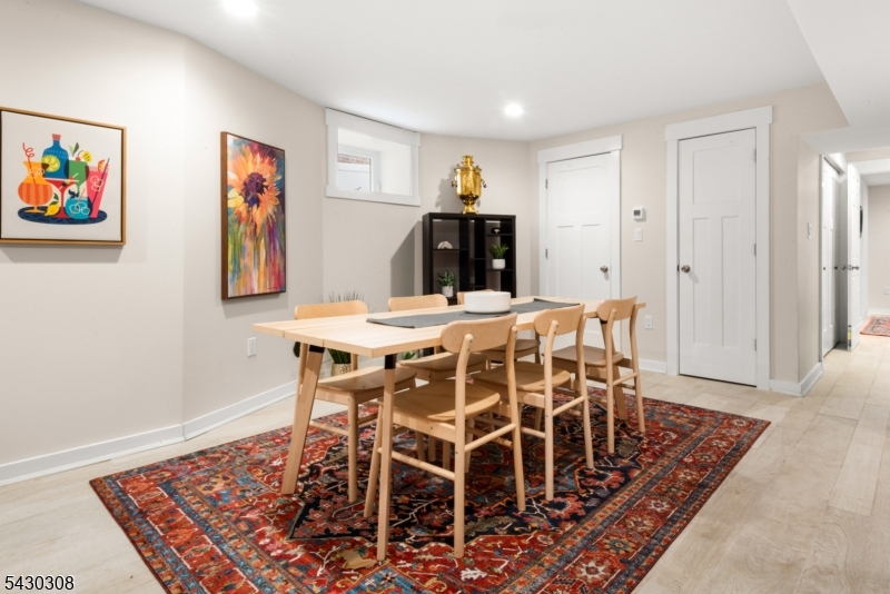 19 78th Street North Bergen, NJ 07047 - Photo 32 of 42 a dining room with furniture and wooden floor