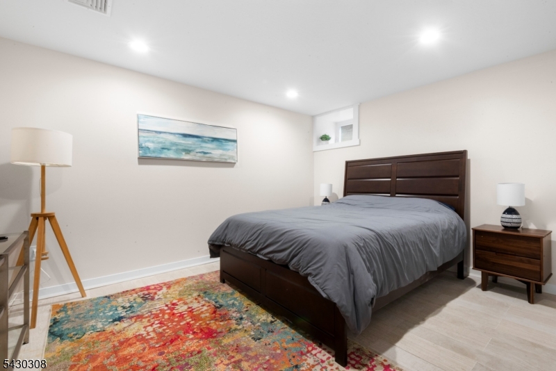 19 78th Street North Bergen, NJ 07047 - Photo 33 of 42 a bedroom with a bed and a window