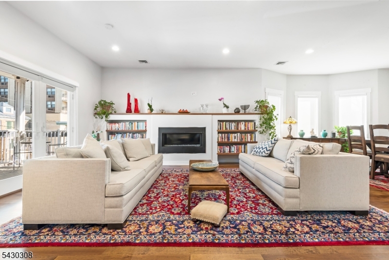 19 78th Street North Bergen, NJ 07047 - Photo 7 of 42 a living room with furniture and a fireplace