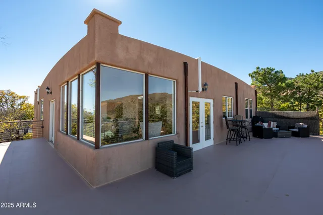 a view of a chair and table in the balcony