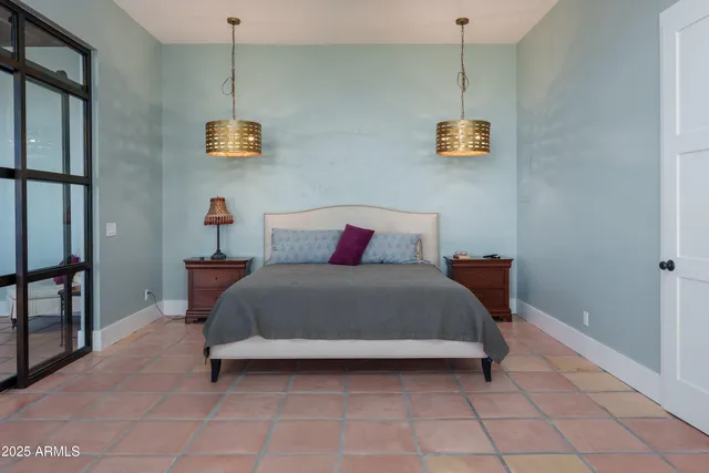 a living room with furniture a rug and a flat screen tv