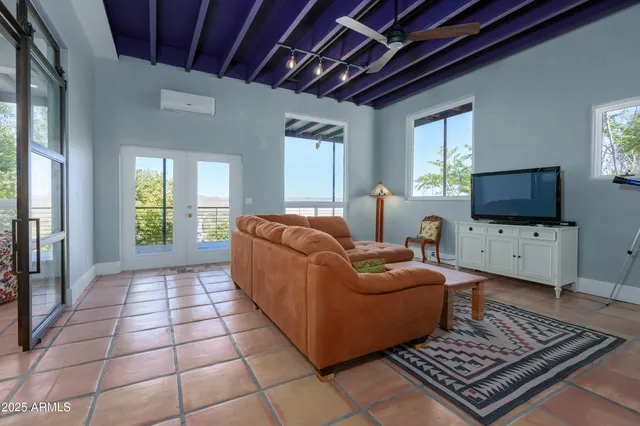 a bedroom with bed and a window