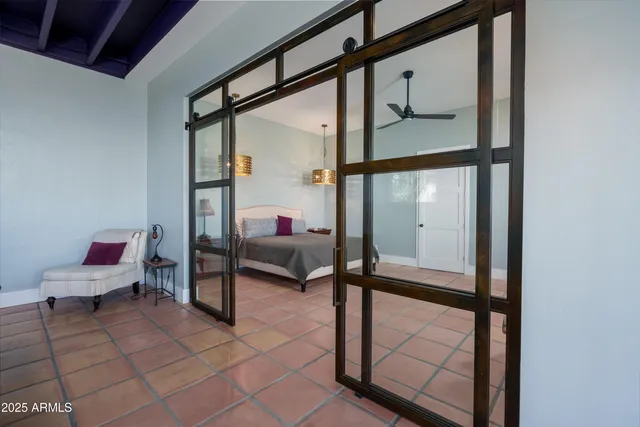 a view of a room with window and ceiling fan