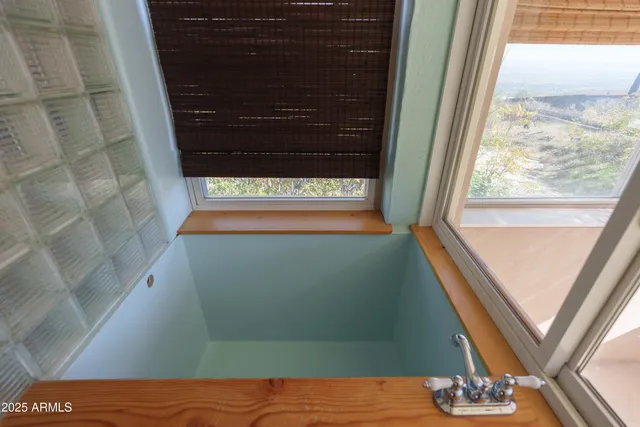 a living room with furniture and a gym equipment