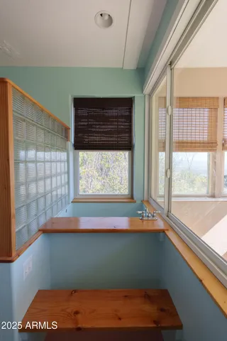 a view of a dinning table and chairs in the patio