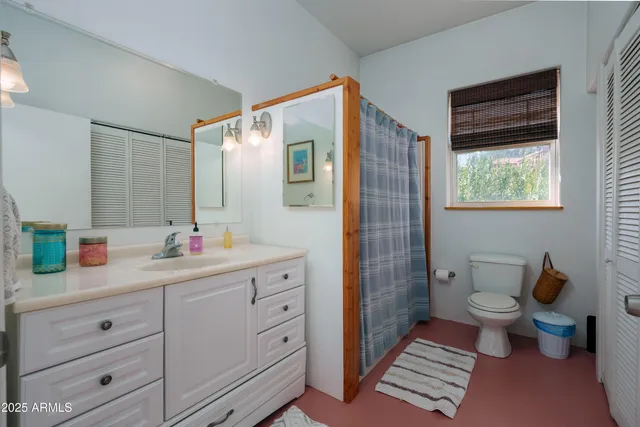 a living room with furniture a pool table and a fireplace