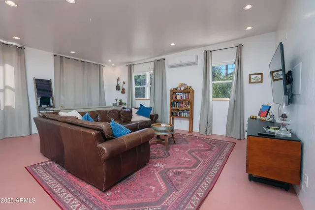 a bathroom with a tub a sink and a mirror