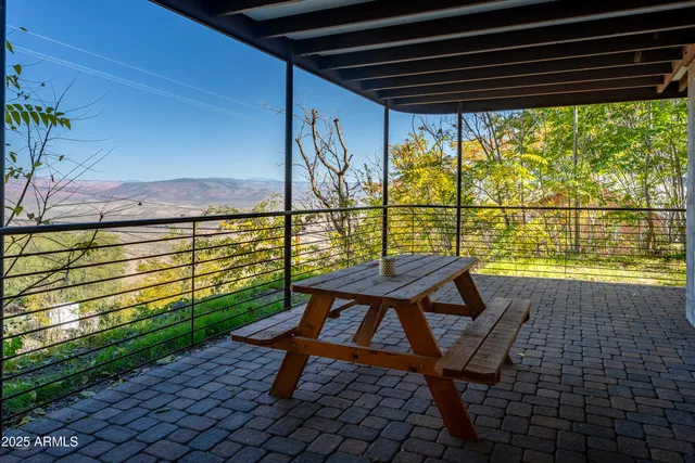 a living room with furniture a window and gym equipment