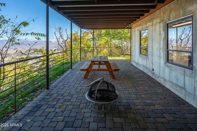 a view of a patio with table and chairs