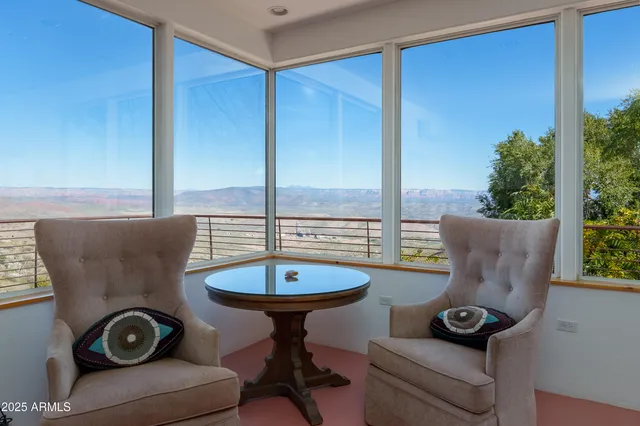 a view of a mountain in the distance in a field