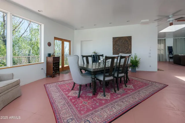 a kitchen with stainless steel appliances granite countertop a sink a stove and cabinets