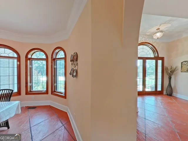 a view of a livingroom with furniture and staircase