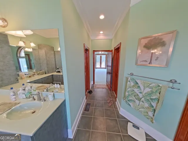 a bathroom with a sink double vanity and a mirror