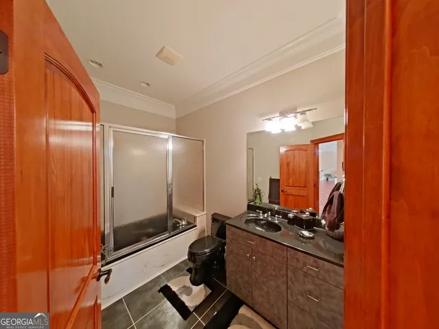 a view of a storage & utility room with a sink