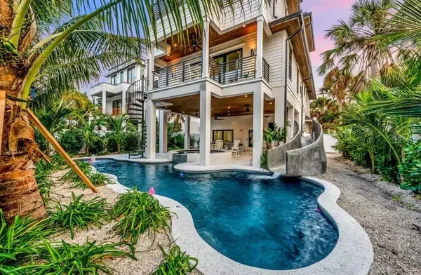 a view of a house with swimming pool