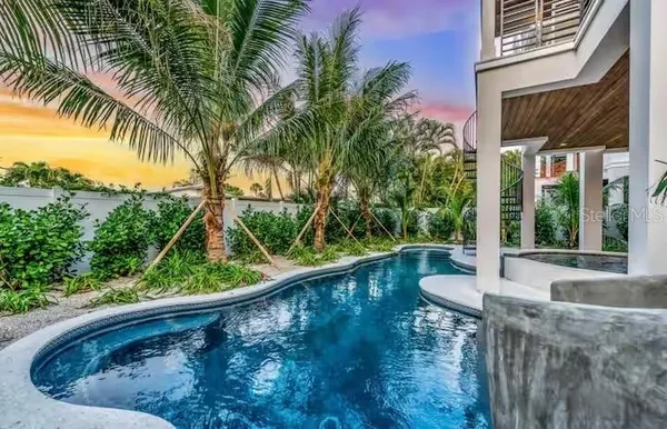 a view of a swimming pool with a patio