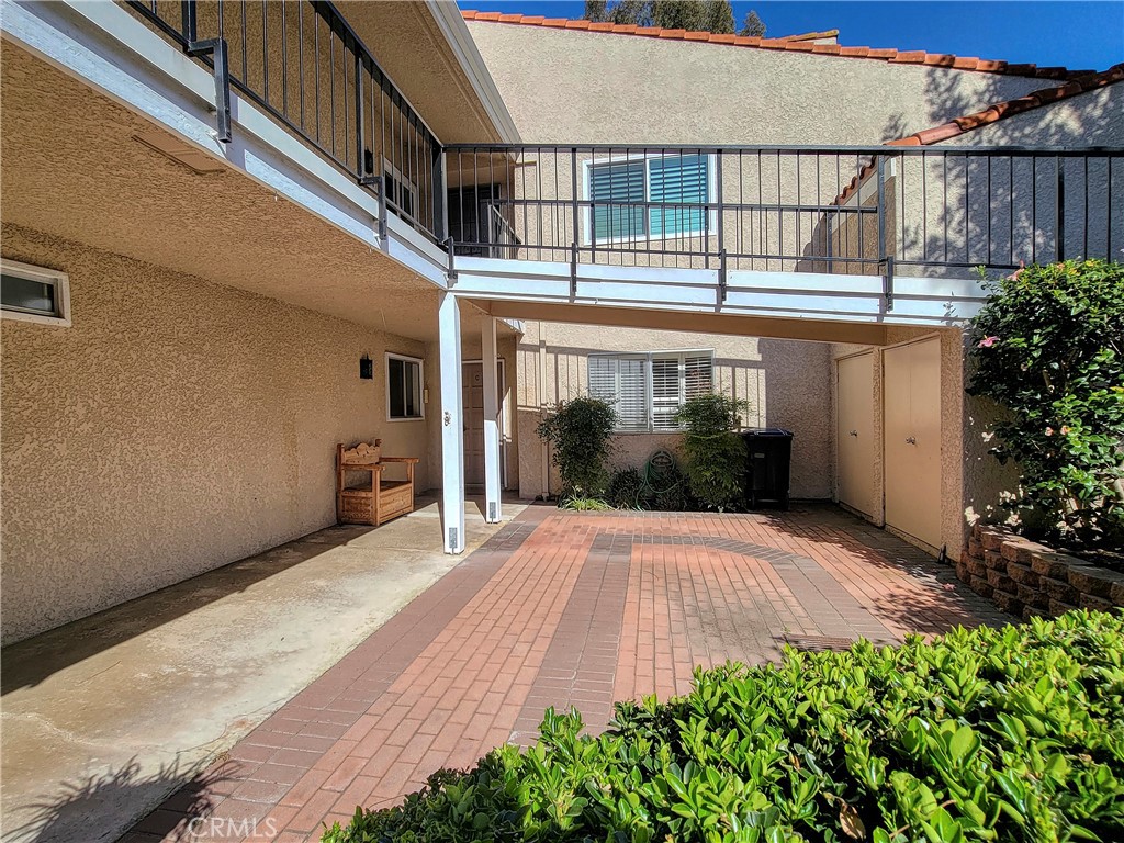 3370 Punta Alta, Unit C Laguna Woods, CA 92637 - Photo 2 of 29 a view of a house with a yard