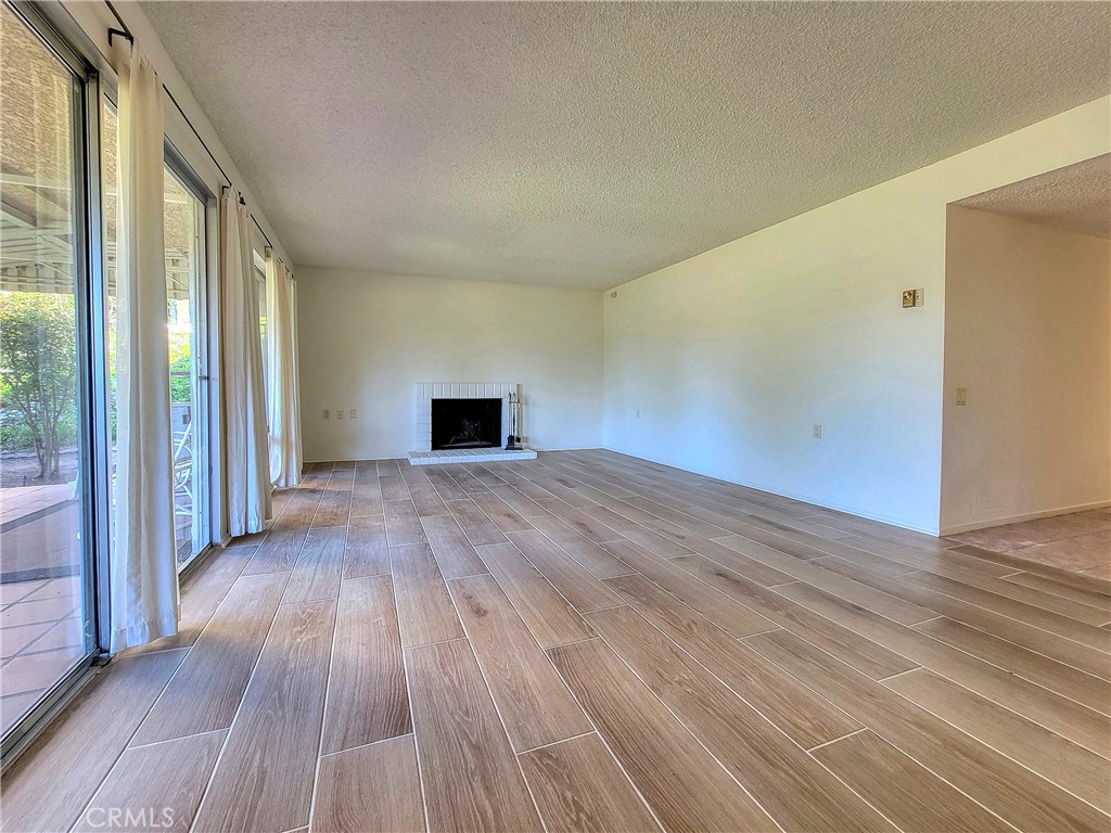 3370 Punta Alta, Unit C Laguna Woods, CA 92637 - Photo 5 of 29 a view of empty room with wooden floor