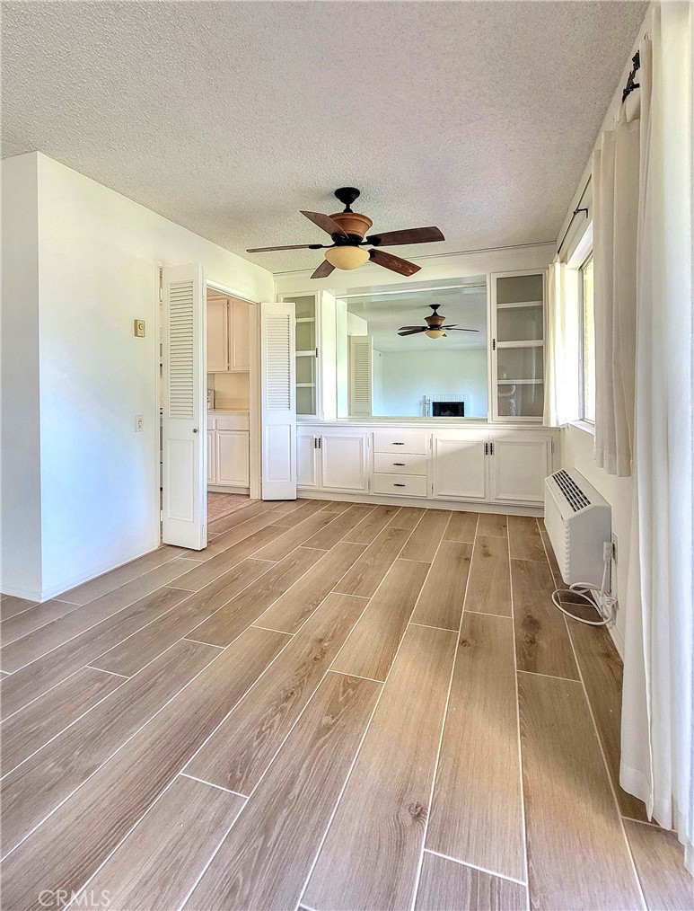 3370 Punta Alta, Unit C Laguna Woods, CA 92637 - Photo 7 of 29 a view of spacious bedroom with a large window
