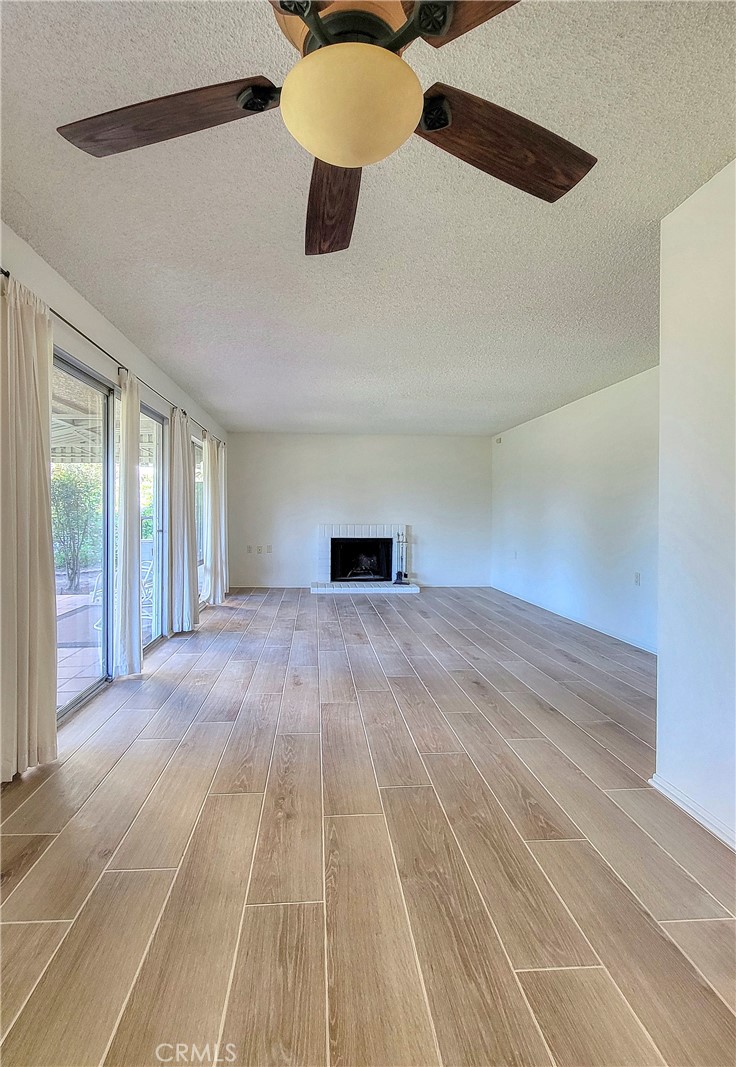 3370 Punta Alta, Unit C Laguna Woods, CA 92637 - Photo 9 of 29 a view of empty room with wooden floor