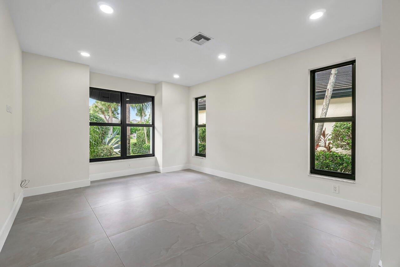 5529 Steeple Chase Boca Raton, FL 33496 - Photo 23 of 56 an empty room with windows and closet