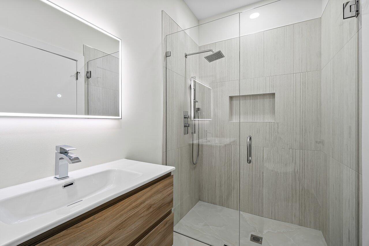 5529 Steeple Chase Boca Raton, FL 33496 - Photo 25 of 56 a bathroom with a shower sink and toilet