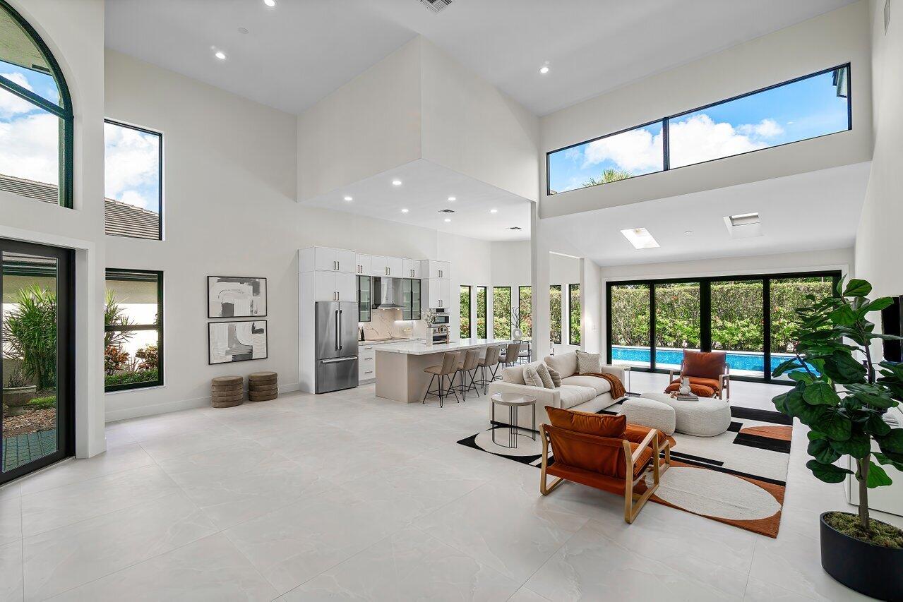 5529 Steeple Chase Boca Raton, FL 33496 - Photo 3 of 56 a living room with furniture and a large window