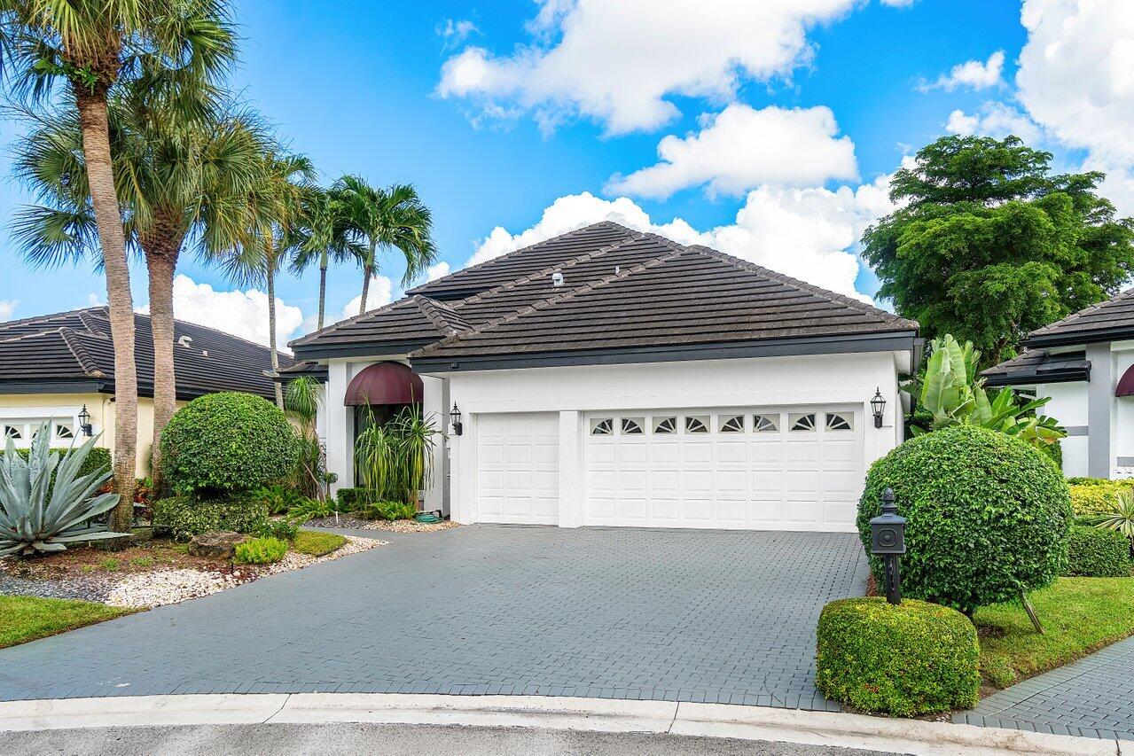 5529 Steeple Chase Boca Raton, FL 33496 - Photo 33 of 56 a front view of house with yard and trees around