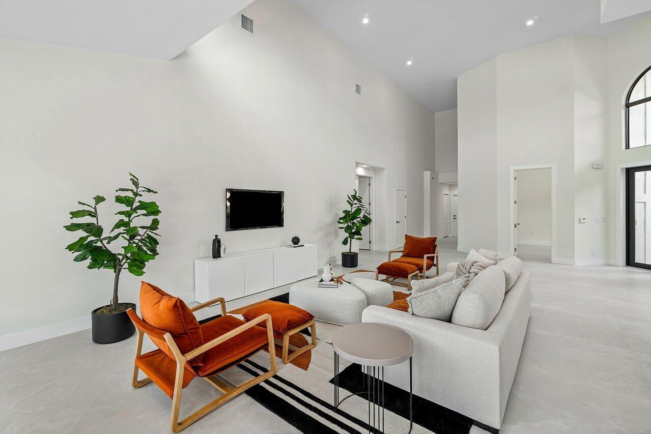 5529 Steeple Chase Boca Raton, FL 33496 - Photo 7 of 56 a living room with furniture and a flat screen tv