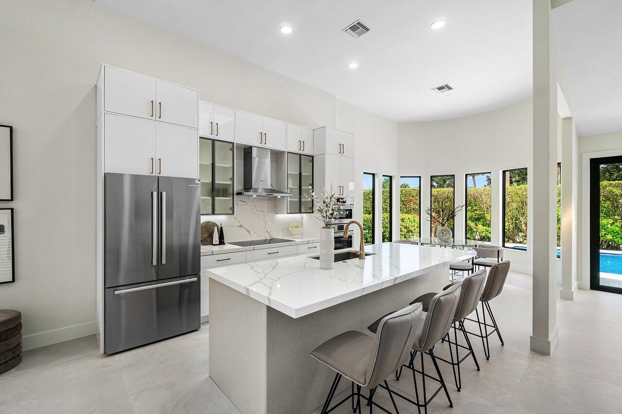 5529 Steeple Chase Boca Raton, FL 33496 - Photo 8 of 56 a kitchen with refrigerator and chairs