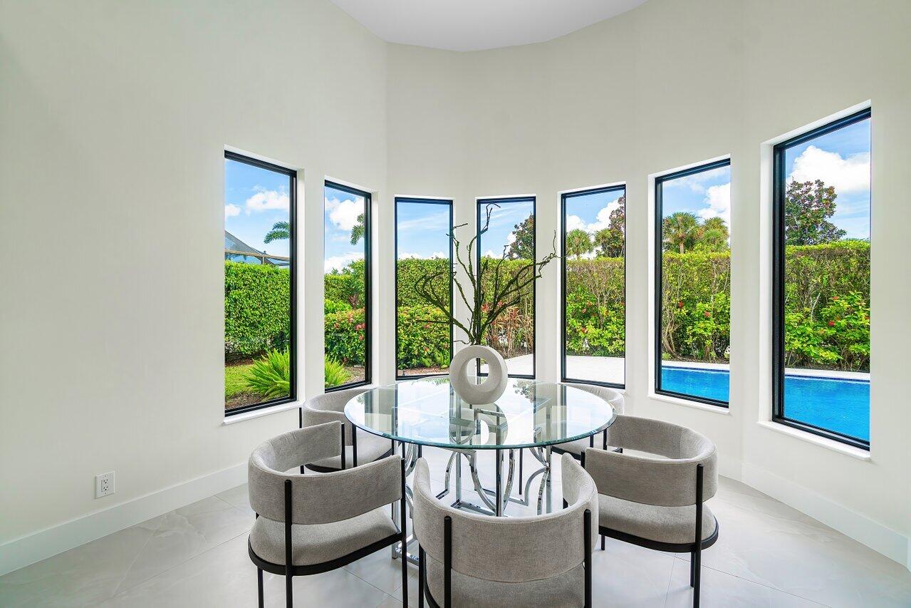 5529 Steeple Chase Boca Raton, FL 33496 - Photo 10 of 56 a living room with furniture and a large window