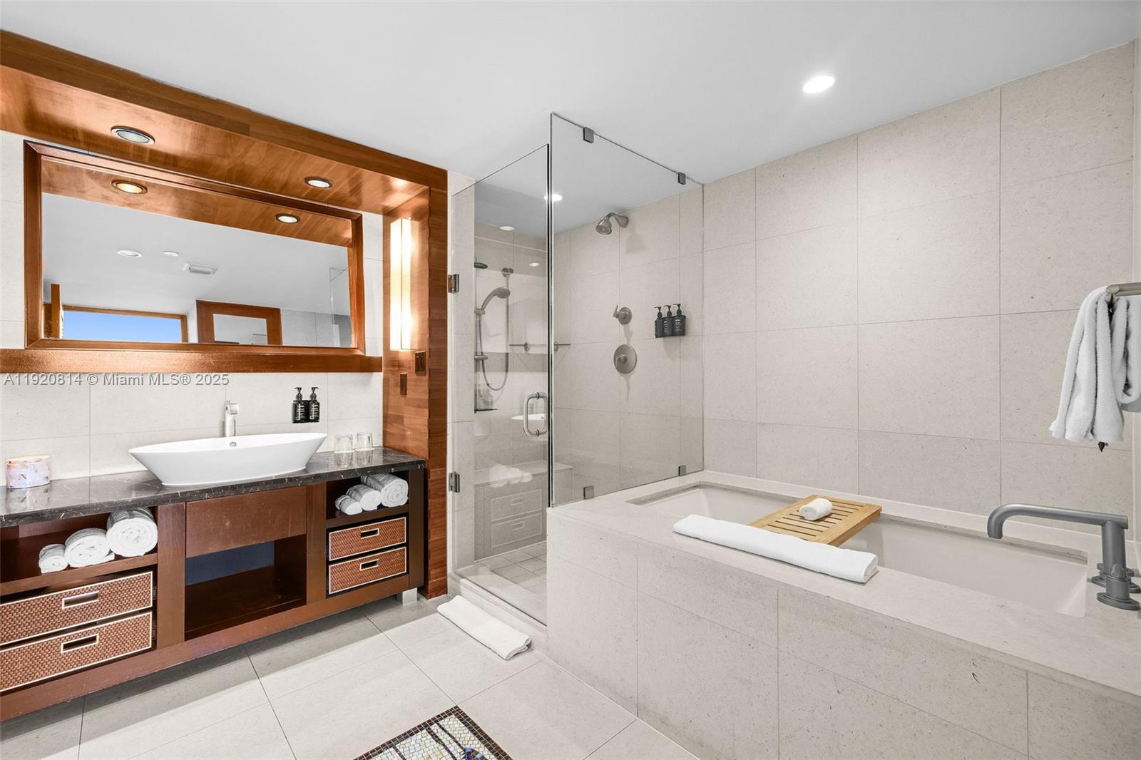 6801 Collins Avenue, Unit 822(DOOR) Miami Beach, FL 33141 - Photo 14 of 30 a bathroom with a tub a sink and mirror