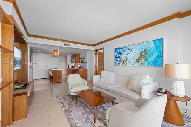 a living room with furniture and a night stand