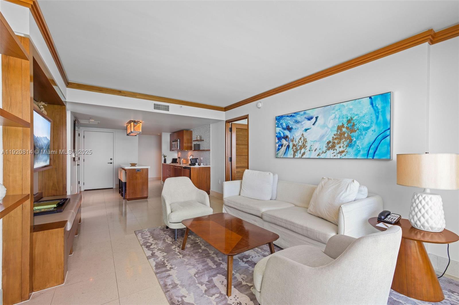 6801 Collins Avenue, Unit 822(DOOR) Miami Beach, FL 33141 - Photo 7 of 30 a living room with furniture and a night stand