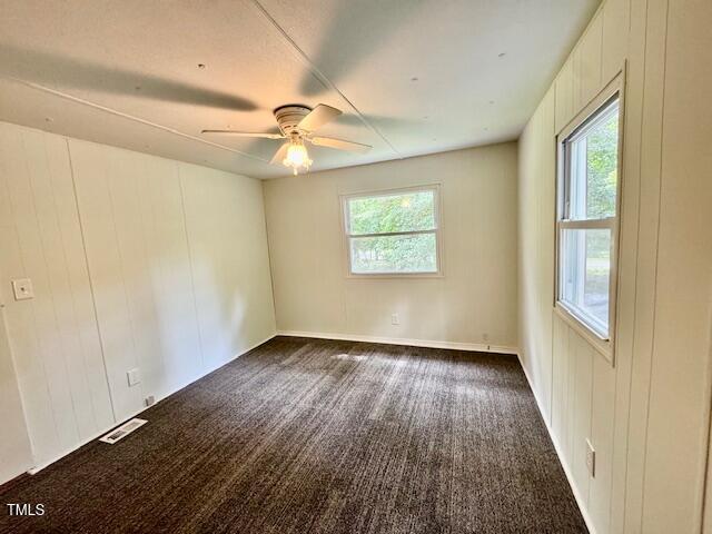 951 Harris Mill Road Rougemont, NC 27572 - Photo 17 of 89 a view of an empty room with a window and wooden floor