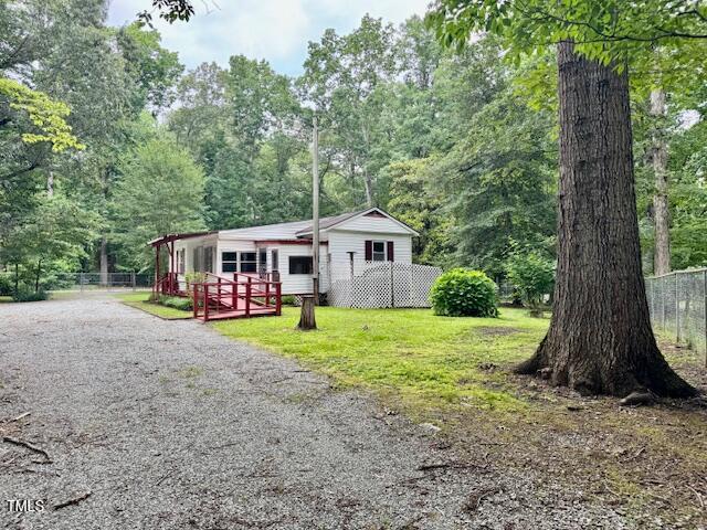 951 Harris Mill Road Rougemont, NC 27572 - Photo 2 of 89 a view of a house with backyard and garden