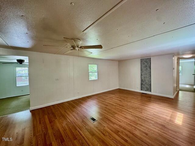 951 Harris Mill Road Rougemont, NC 27572 - Photo 24 of 89 a view of empty room with wooden floor and fan