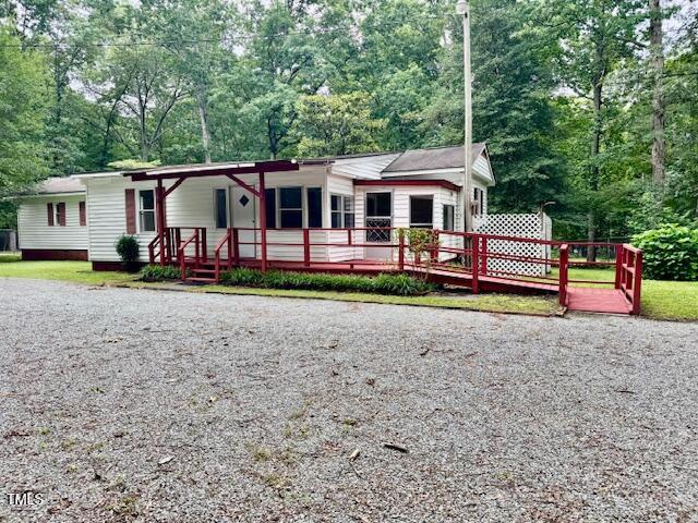 951 Harris Mill Road Rougemont, NC 27572 - Photo 3 of 89 a front view of a house with garden