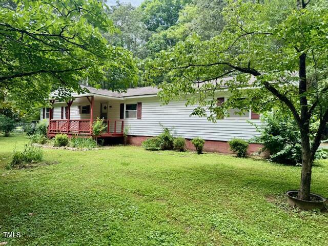 951 Harris Mill Road Rougemont, NC 27572 - Photo 62 of 89 a front view of a house with garden