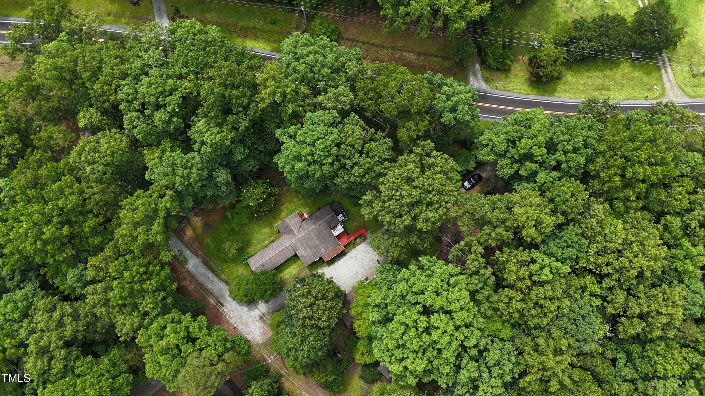 951 Harris Mill Road Rougemont, NC 27572 - Photo 89 of 89 an aerial view of residential house with outdoor space and trees around