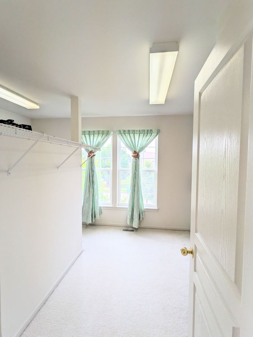 24632 Apollo Drive Plainfield, IL 60585 - Photo 11 of 22 a view of an empty room with a window
