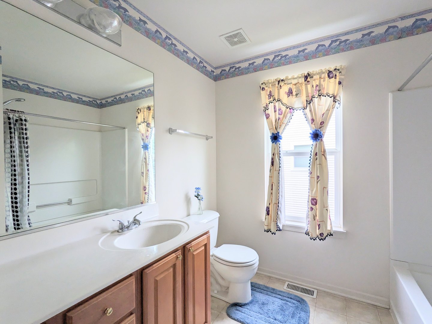 24632 Apollo Drive Plainfield, IL 60585 - Photo 13 of 22 a bathroom with a double vanity sink toilet and a mirror