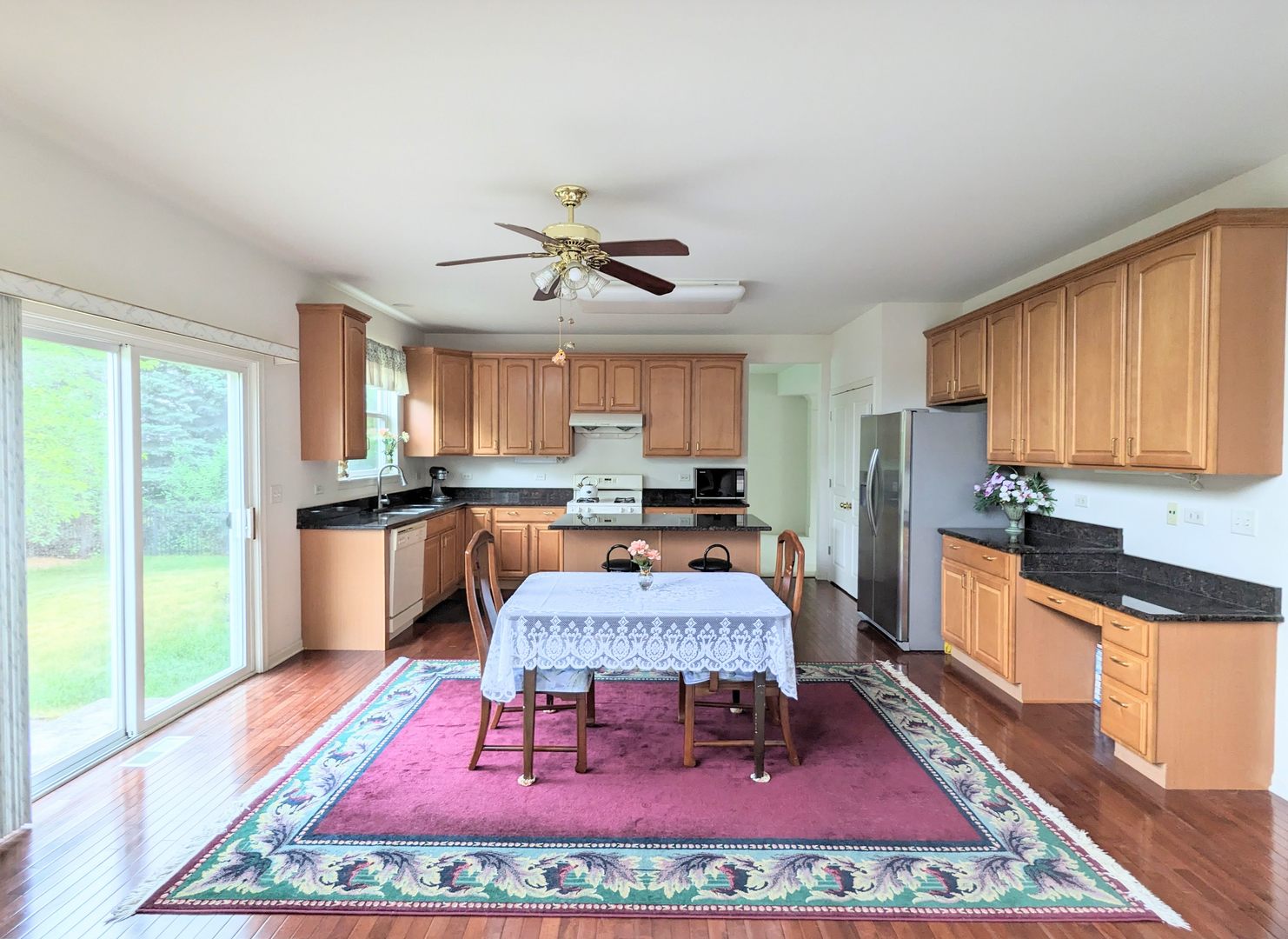 24632 Apollo Drive Plainfield, IL 60585 - Photo 5 of 22 a large kitchen with dining table and chairs